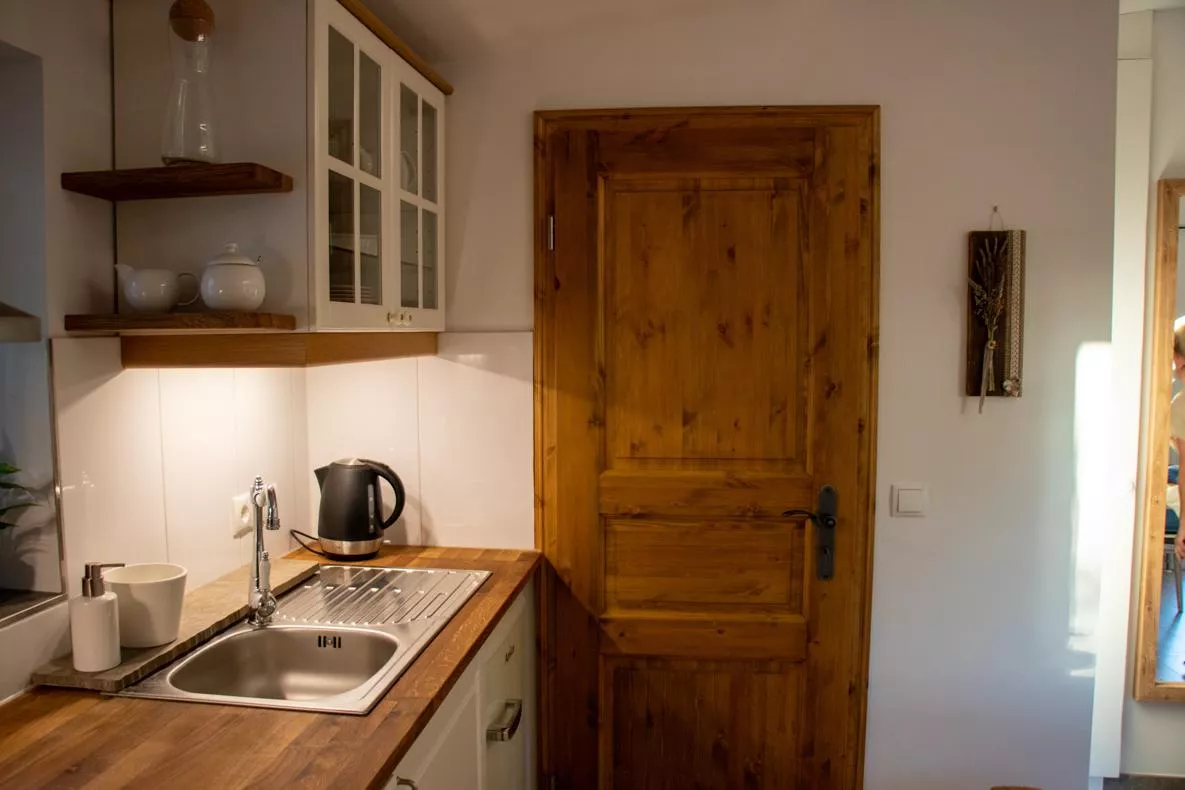 Kitchen with Swiss stone pine door