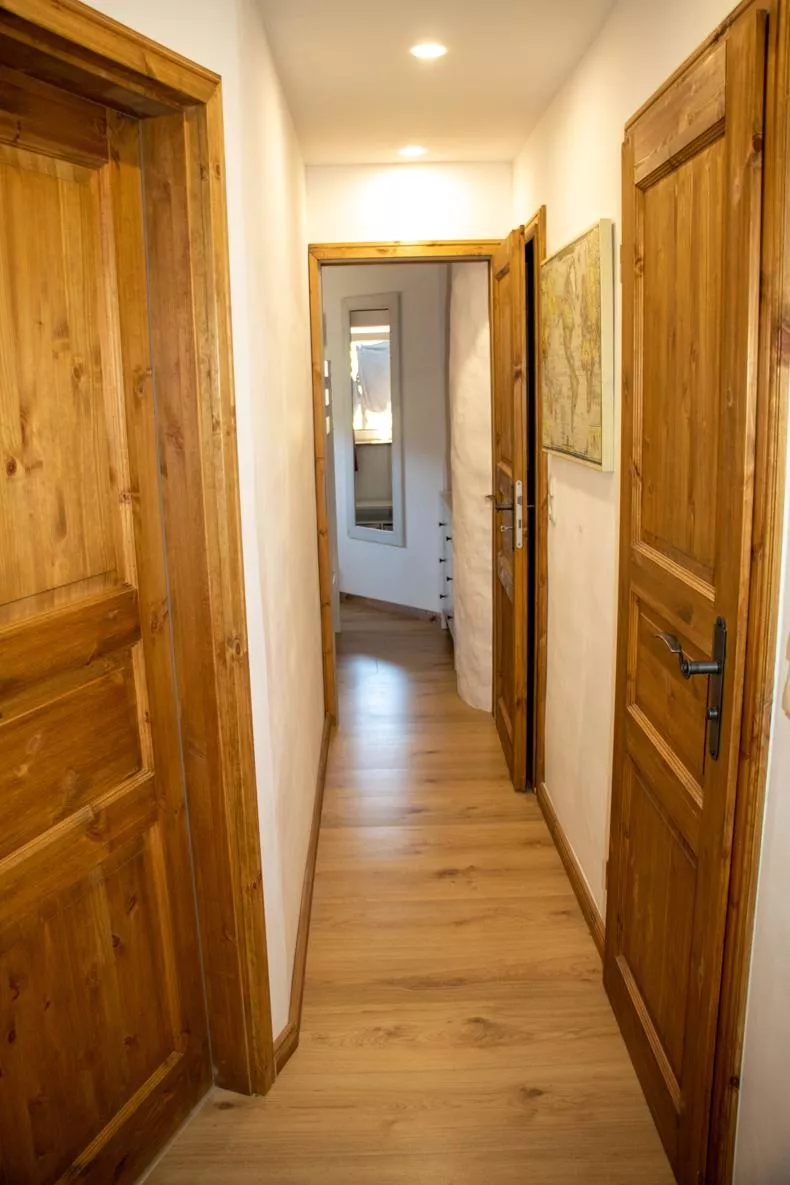 Hallway with Swiss stone pine doors