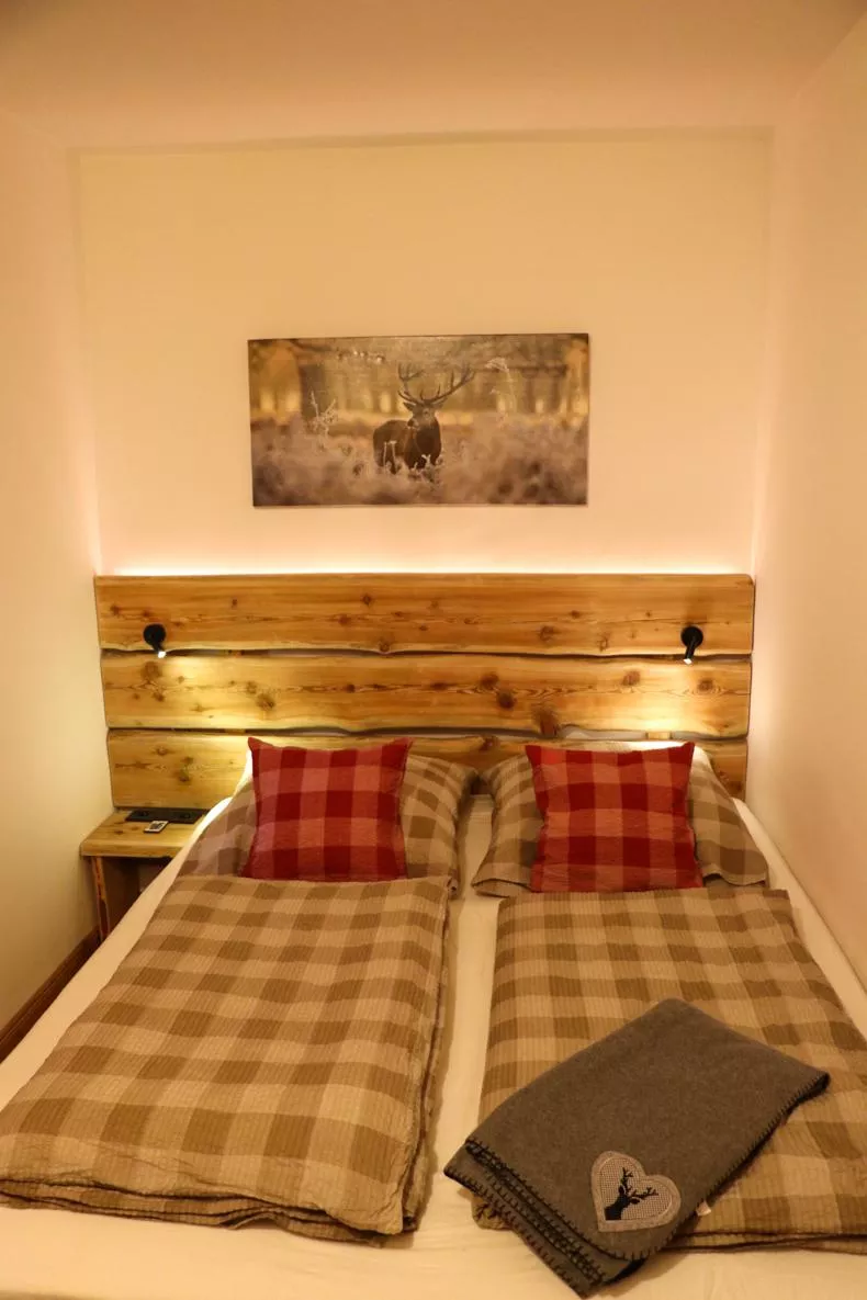 Main bedroom with Swiss stone pine bed